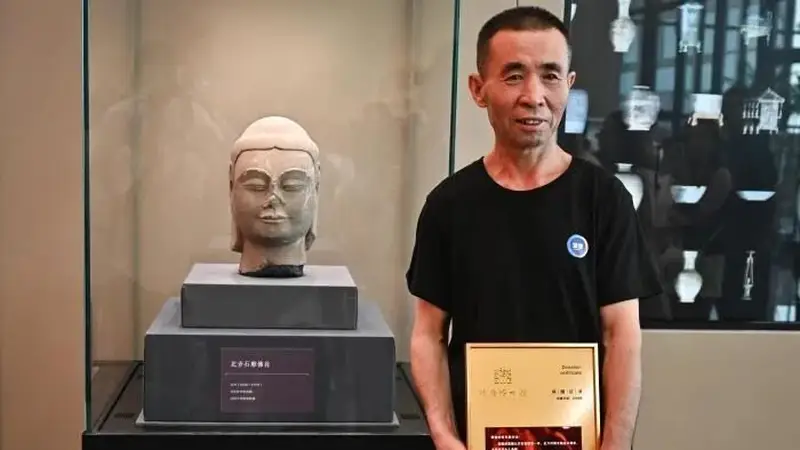 山西村民挖出1400年前佛首 身首合璧获奖励万元