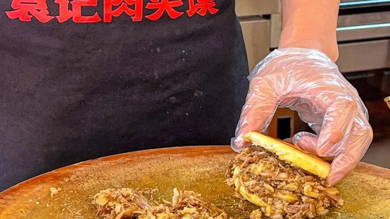 肉夹馍里的肉，为什么通常要切碎再夹？